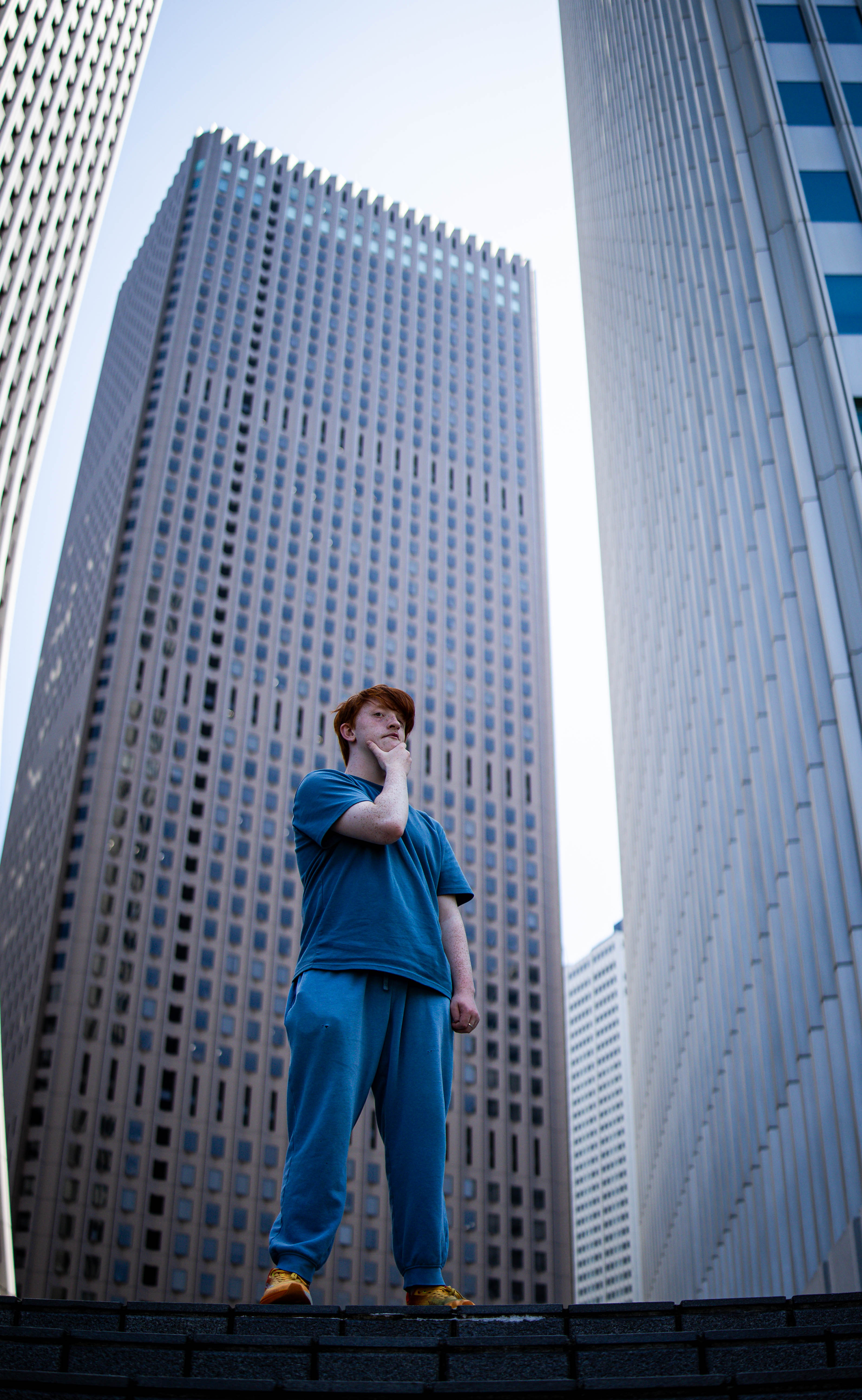 Kendall standing in front of skyscrapers